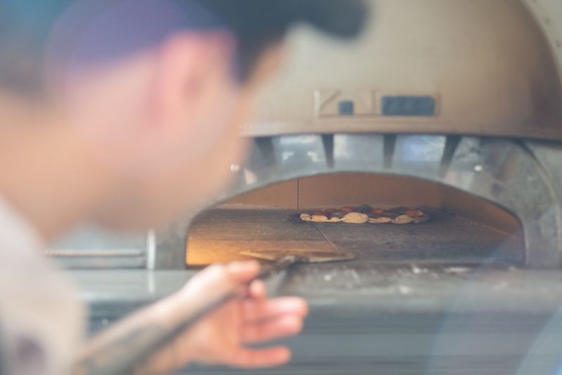 Marcos pizza kitchen — fresh marco's pizza being prepared